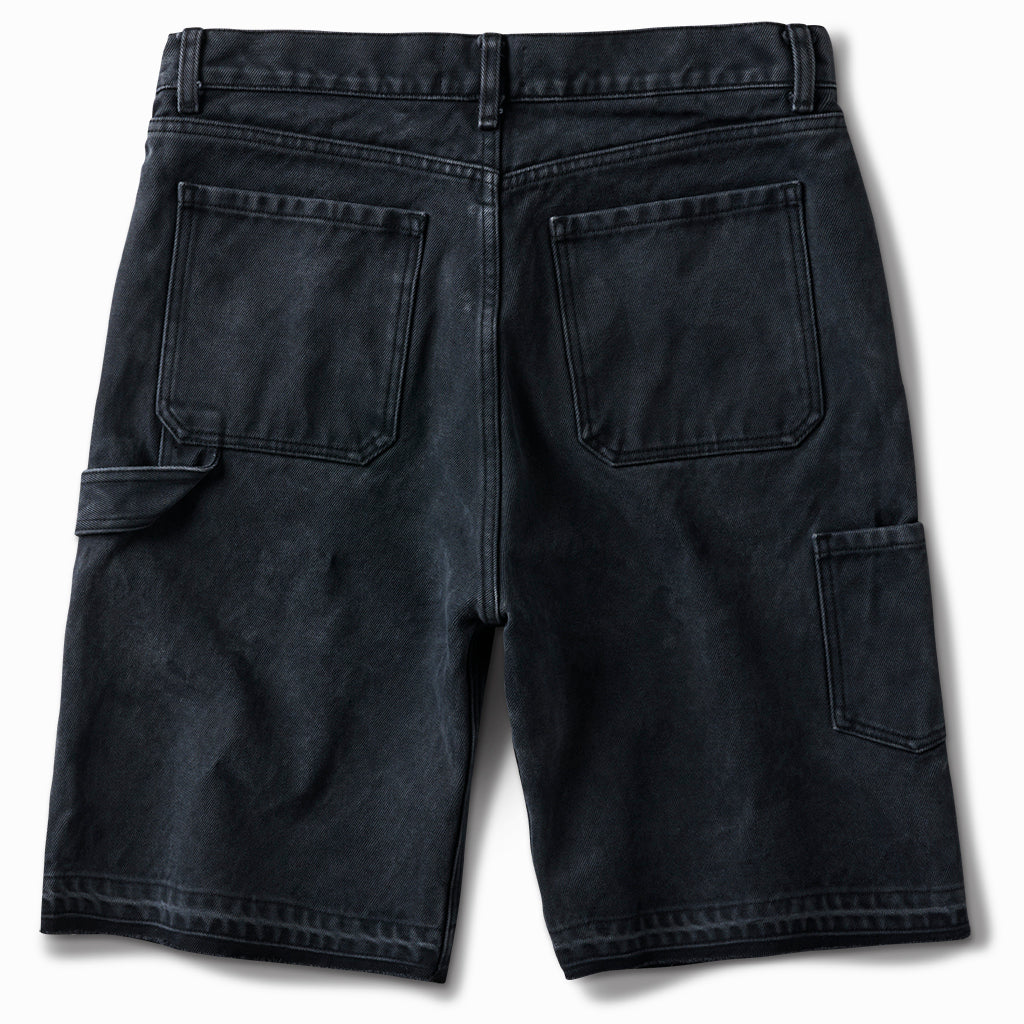 Washed black carpenter shorts, back view, with hammer loop and side pocket