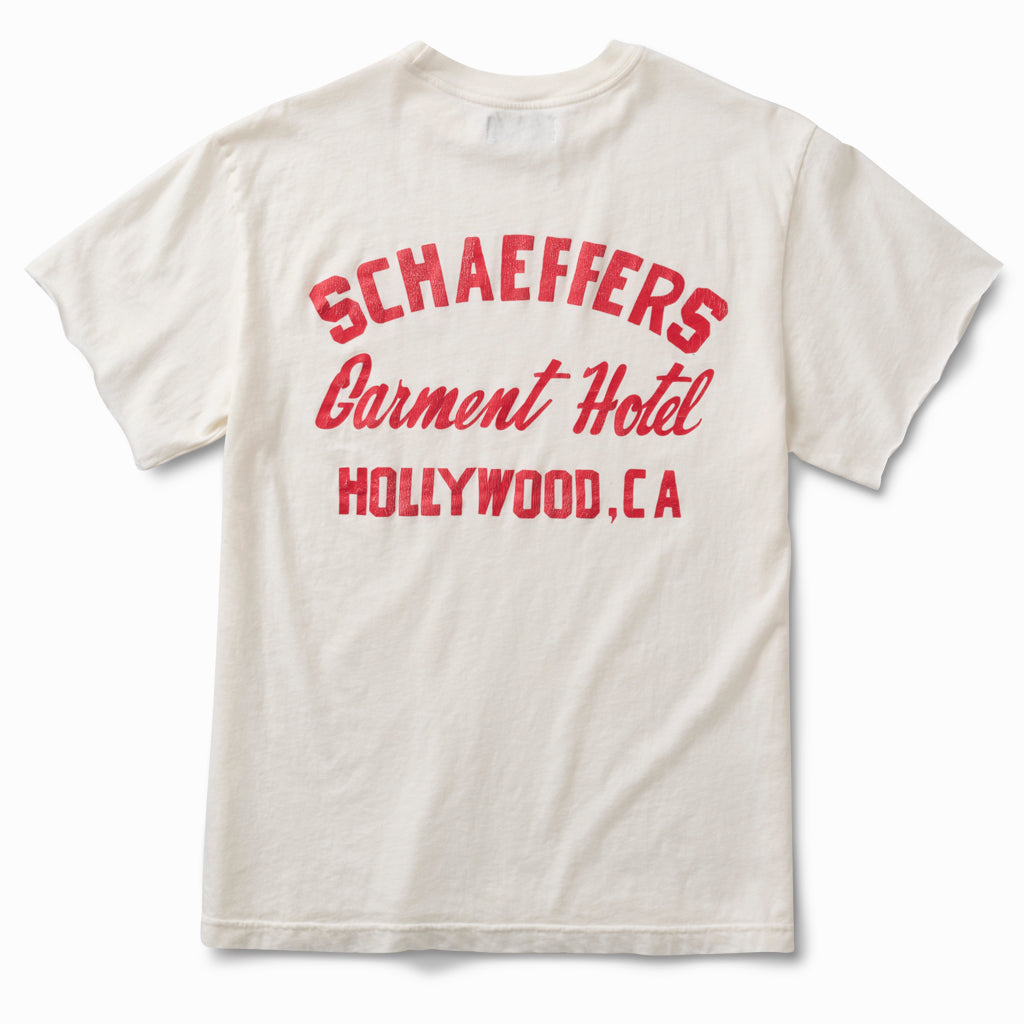 Off-white tee, back view, with a red Schaeffers Garment Hotel Hollywood, CA script print