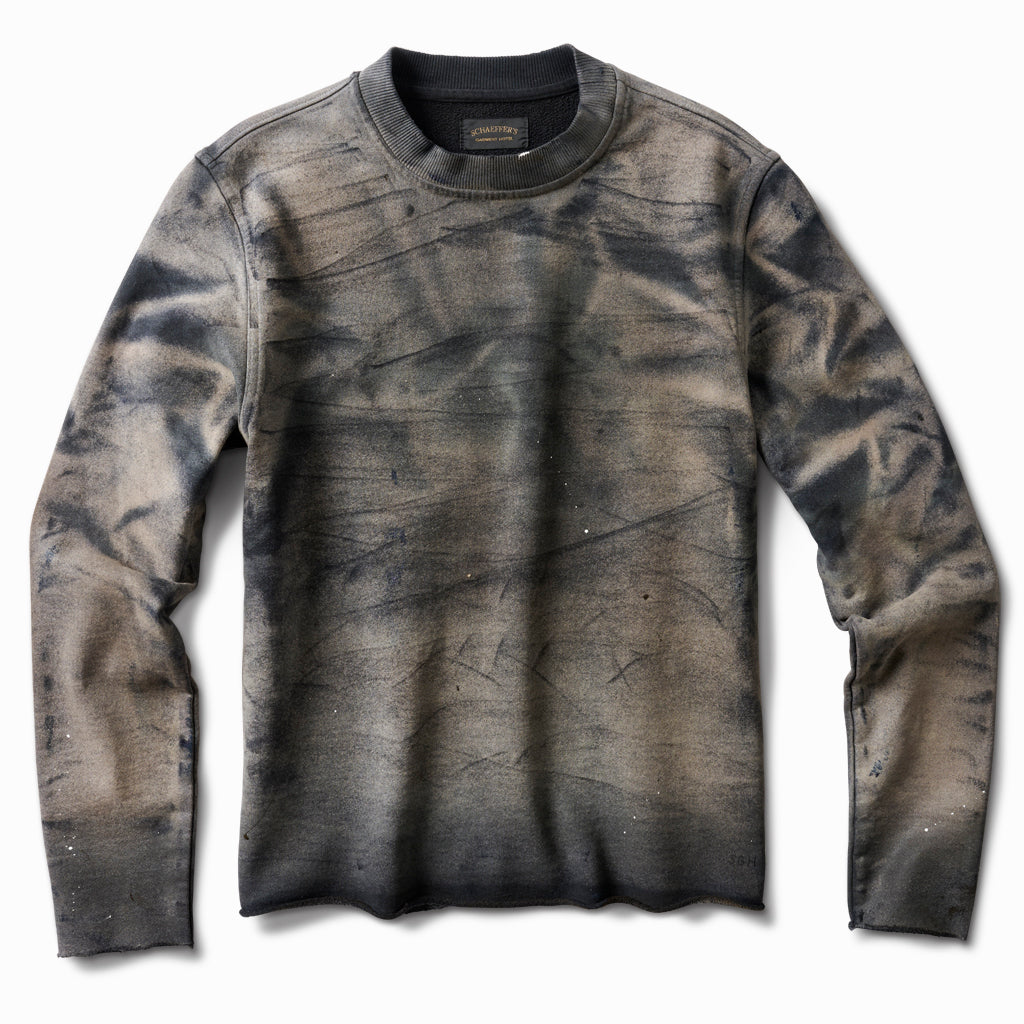Heavily oil-stained ivory French terry crew sweatshirt with grey-brown marbled staining, front view