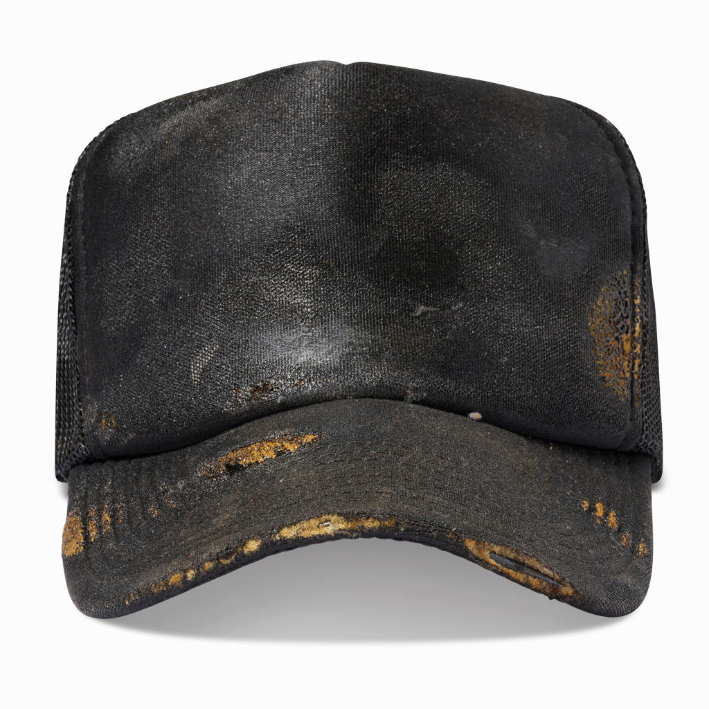 Oil-aged black trucker hat with rust-colored wear on the brim, front view