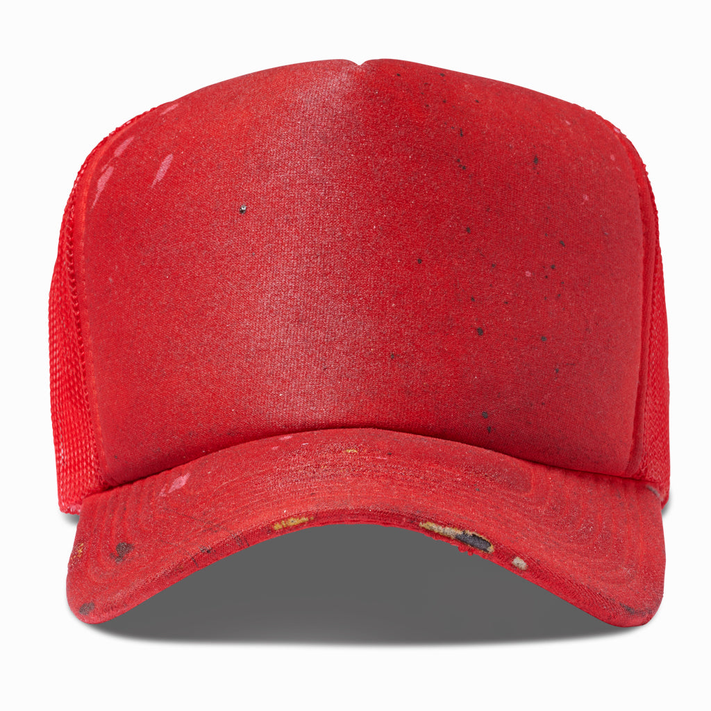 Oil-aged red trucker hat with paint-flecked foam front, front view