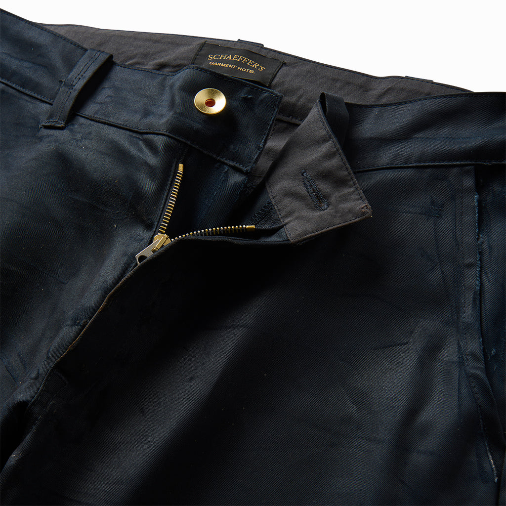 Close-up of the chino's brass button and zip fly with Schaeffer's label