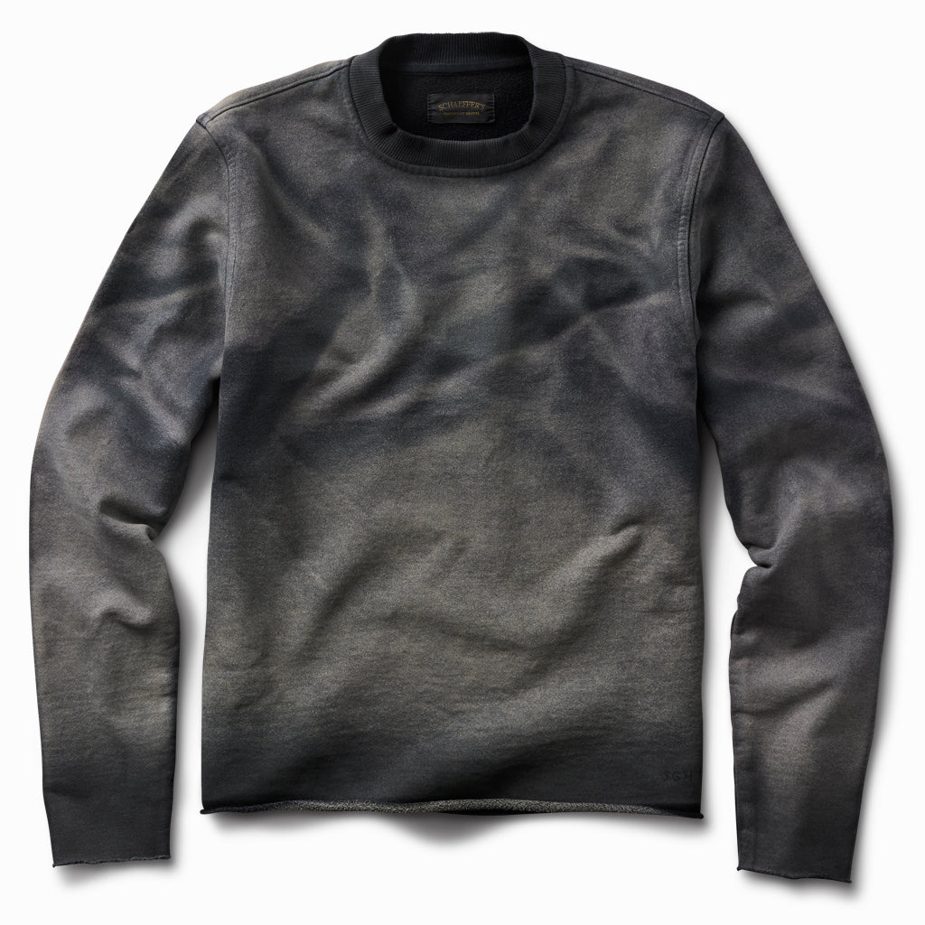 Oil-stained raw edge French terry crew sweatshirt with marbled grey and olive staining, front view