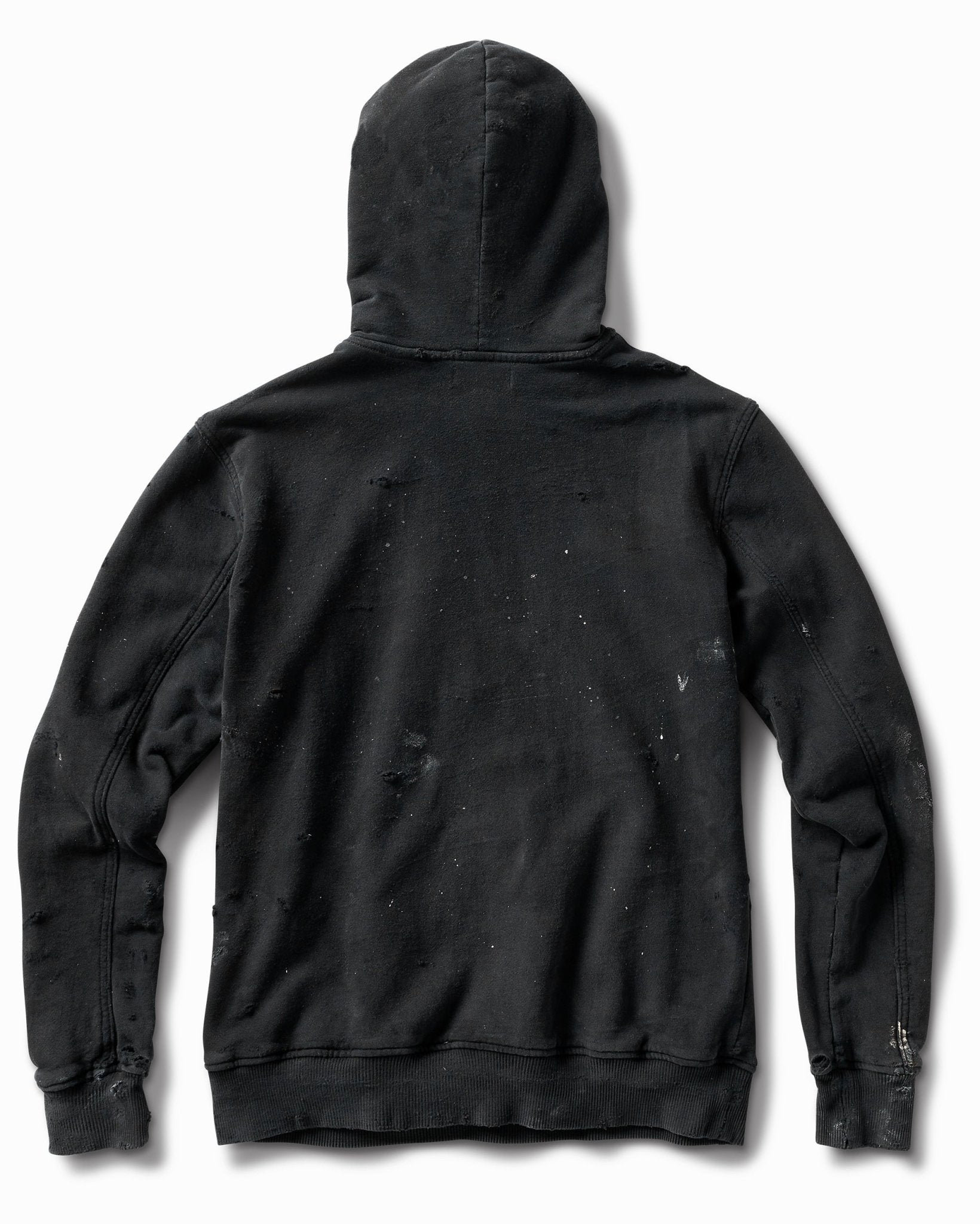 Distressed black hoodie, back view, with paint flecks