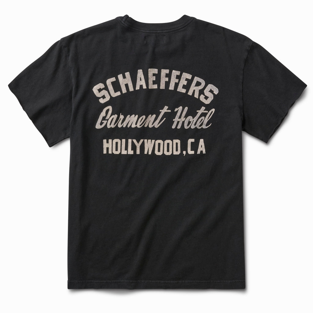 Black tee, back view, with a white Schaeffers Garment Hotel Hollywood, CA script print