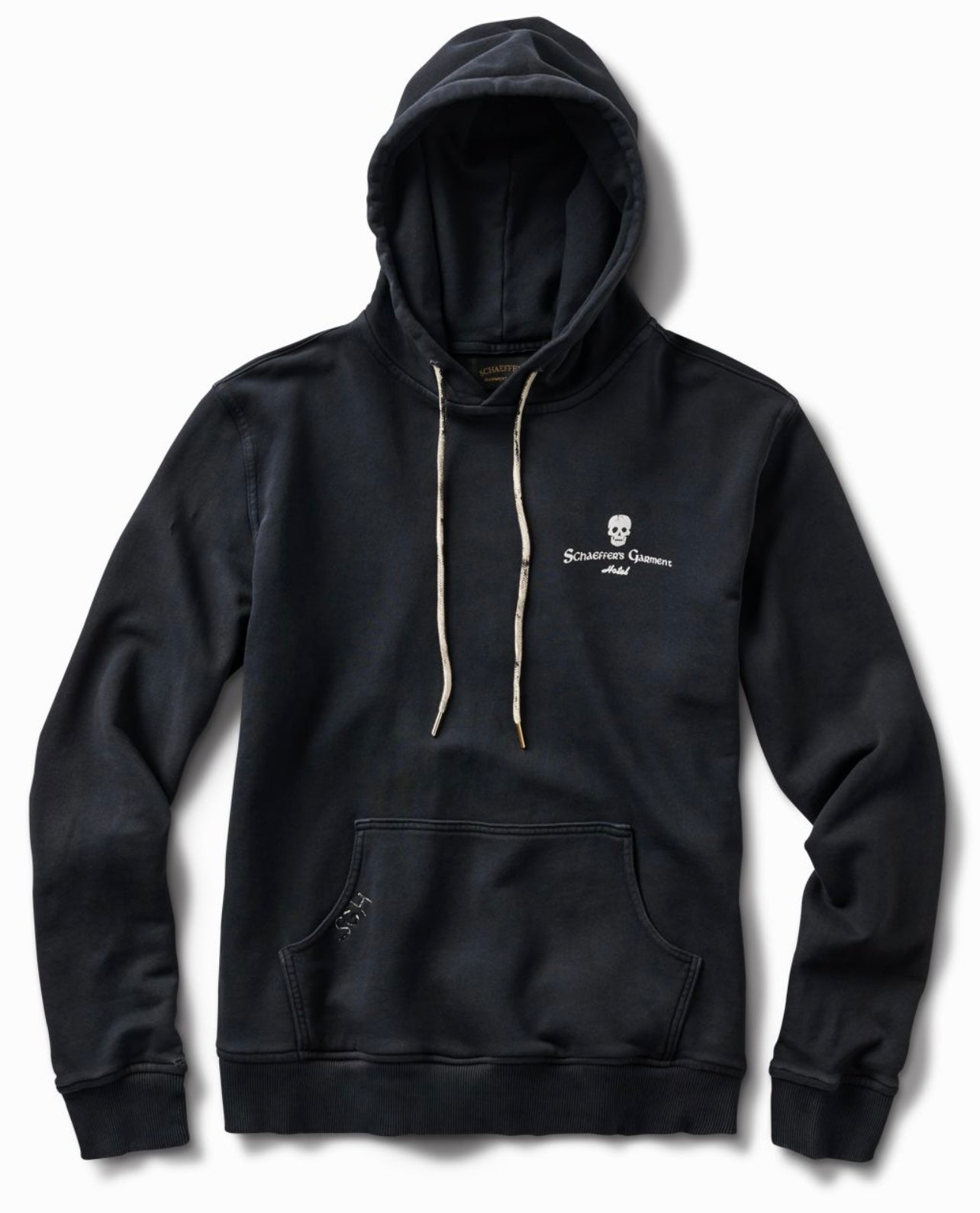 Aged black 17oz French terry hoodie, front view, with a small skull and script chest logo and cream drawcords
