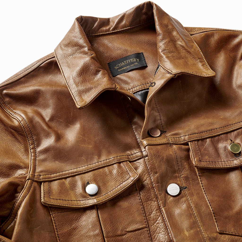 Close-up of the leather jacket's collar, Schaeffer's label and snap-button chest pockets