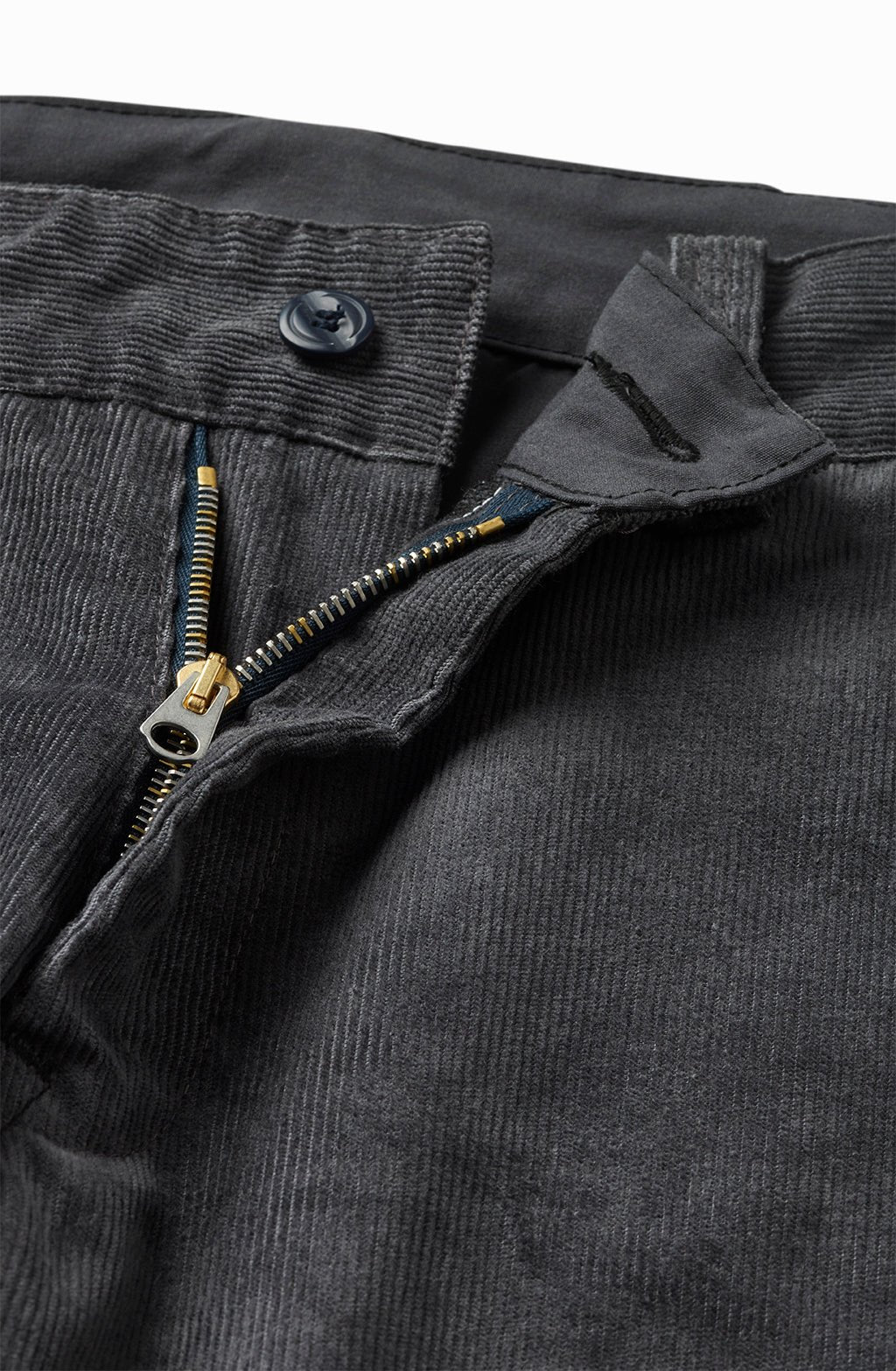 Close-up of the charcoal corduroy chino's zip fly and button