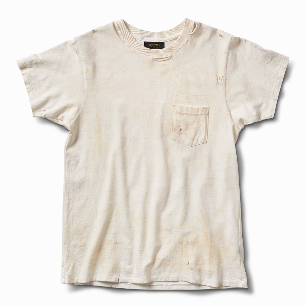 Hand aged and distressed off-white pocket tee with light staining, front view