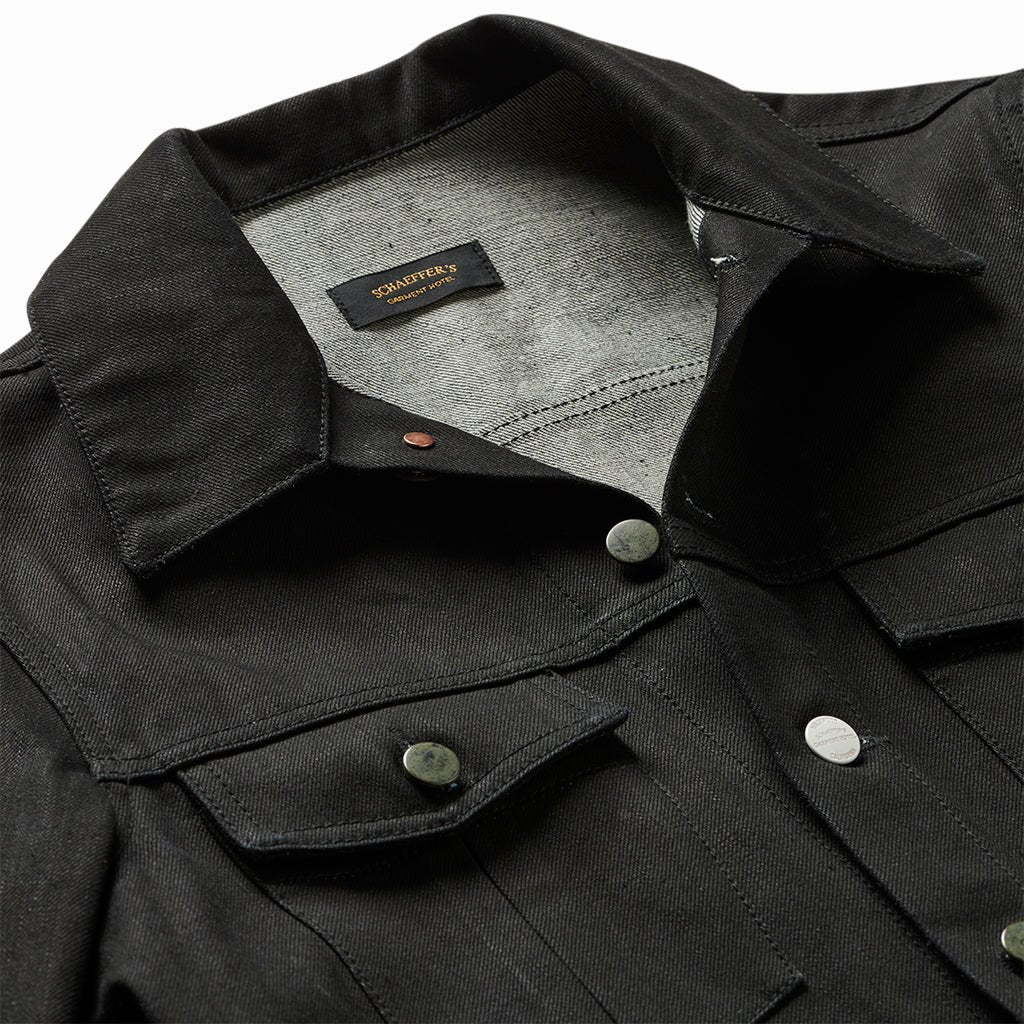 Close-up of the Paloma jacket's collar, Schaeffer's label and flap pocket buttons