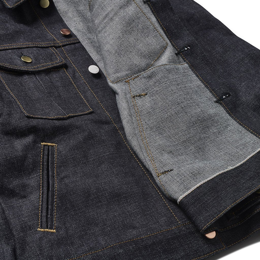 Close-up of the rope indigo jacket's hand pocket and grey selvedge inner placket