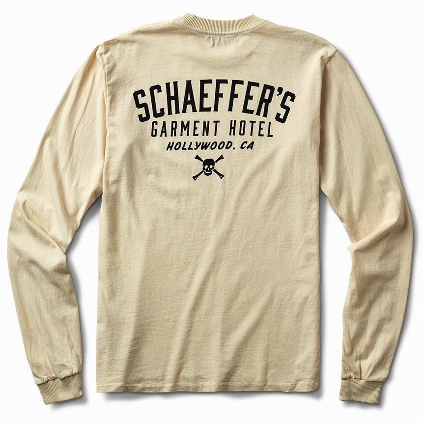 Off-white long sleeve tee, back view, with a black Schaeffer's Garment Hotel Hollywood, CA skull and crossbones print