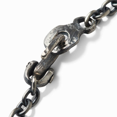 Close-up of the bracelet's hammered sterling silver hook clasp