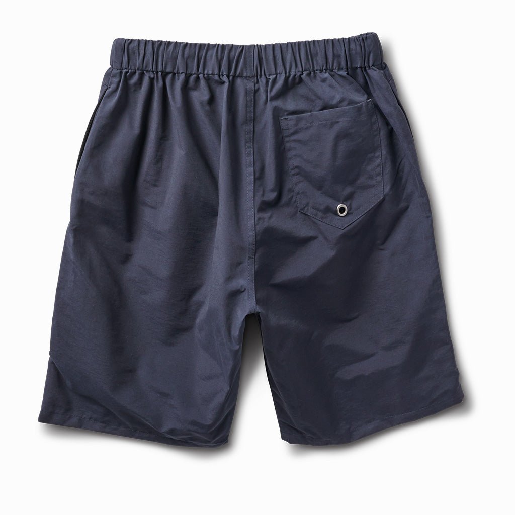 Indigo swim trunks, back view, with a back pocket