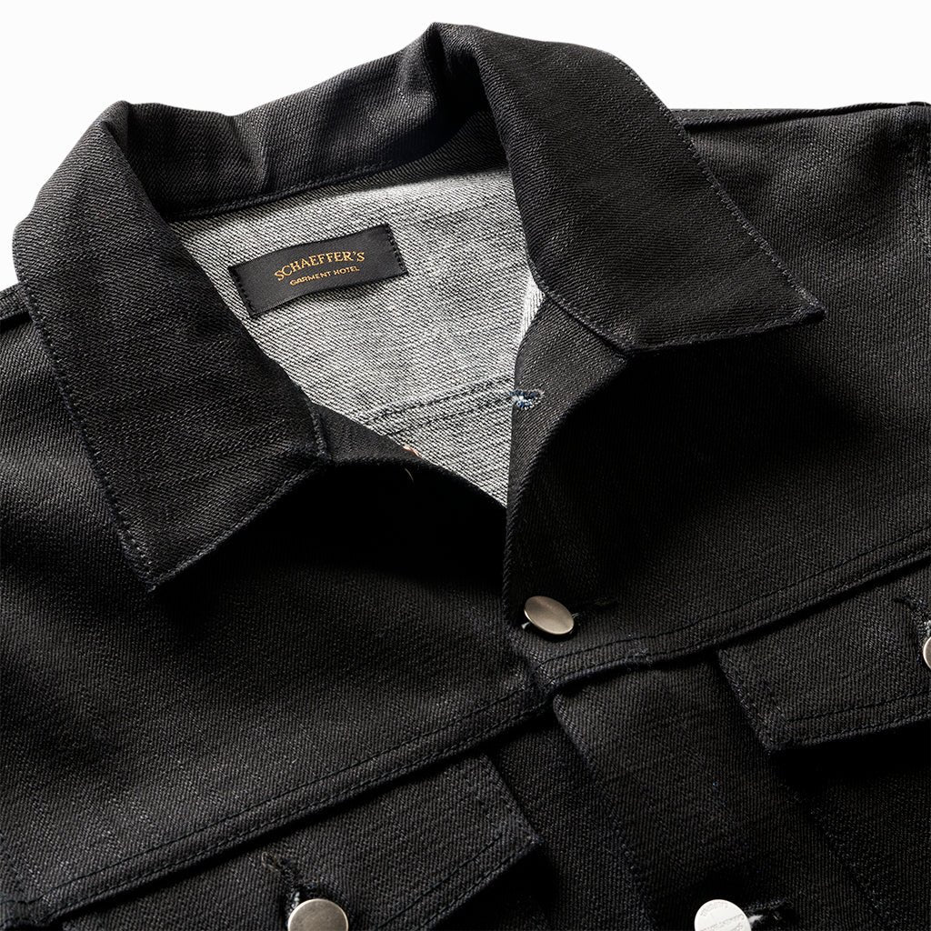 Close-up of the New Paloma jacket's collar, Schaeffer's label and grey selvedge facing